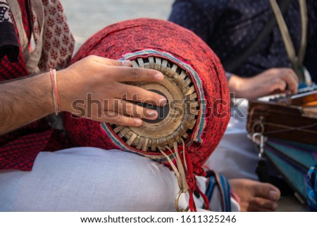 Mrudanga being played by a devotee Royalty-Free Stock Photo #1611325246