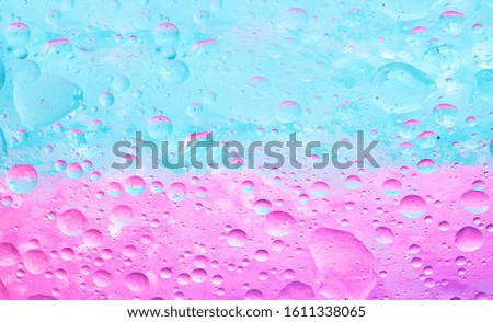  Water bubbles evenly placed in an abstract manner over pastel background. 