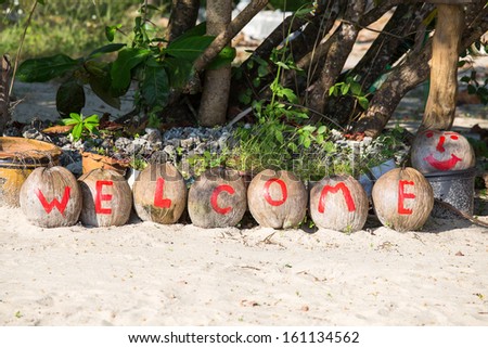 The inscription welcome painted on coconuts in island Koh Chang ,Thailand