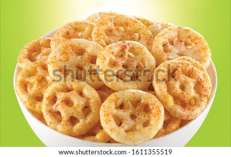 Fried and Spicy wheel Snacks or Fryums (Snacks Pellets) served in a bowl. selective focus - Image Royalty-Free Stock Photo #1611355519