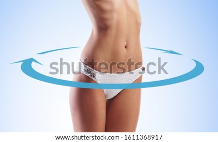 Close-up of thin and beautiful female body. Weight loss, sports, exercising, healthy food and eating, nutrition concept.