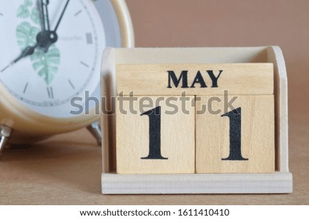 May 11, Cover design with clock in natural concept.