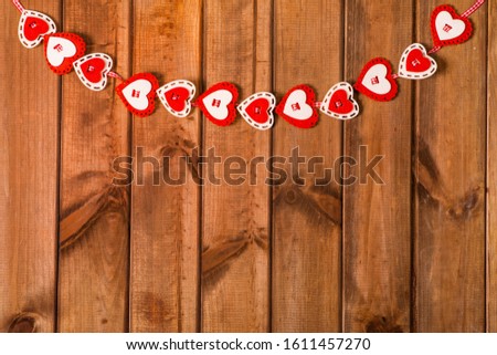Valentine's day red hearts on wooden background