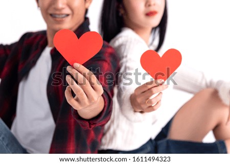 Beautiful Young asian couple at home,enjoy spend time together in celebration Saint Valentine's day,hand hold gift,selfie photo with hand phone,happy and love motion.