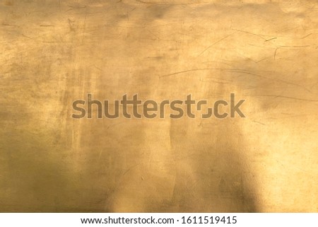The shiny gold background For design and decoration