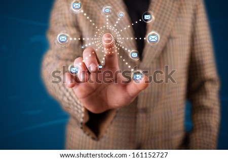Young businessman pressing virtual messaging type of icons