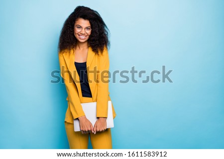 Photo of pretty dark skin wavy business lady holding notebook friendly work atmosphere visit corporate training wear specs yellow suit blazer pants isolated blue color background