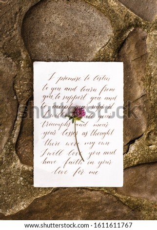 Wedding details flat lay on stone background. Wedding invitation. Ring box. Copyspace. Mock up. Clover