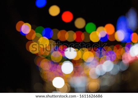 The light from the roadside restaurant Shining bright colors The bokeh from the light is a beautiful background at night. It's an abstract background.