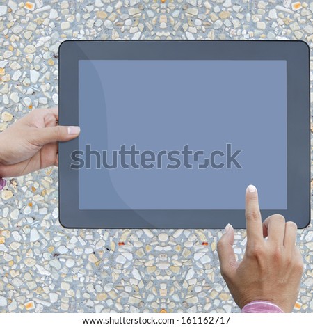 art work hand of business man hold the touch screen computer  on stone background