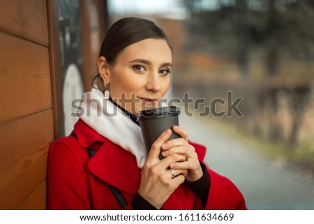 girl on a walk with coffee