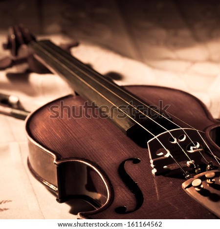 Vintage violin and bow in still life concept