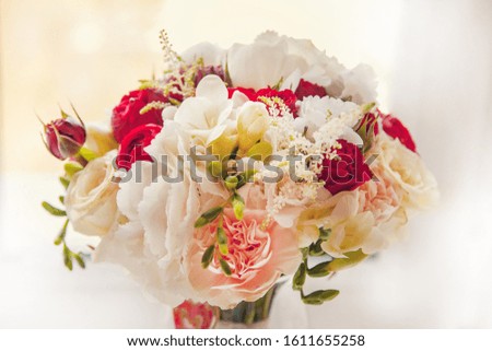 Beautiful tender bride's wedding bouquet made of peonies and alstromeries