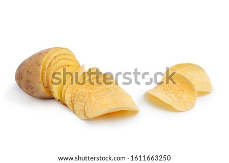 Sliced potatoes and chips on a white isolated background. Creative photography. The idea is how potatoes turn into chips.