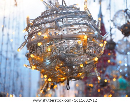 Street Christmas decorations in the form of a garland twisted into a ball. Close up