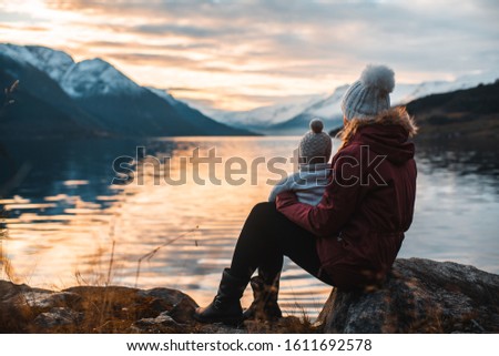 mother and daugther looking at scenery Royalty-Free Stock Photo #1611692578