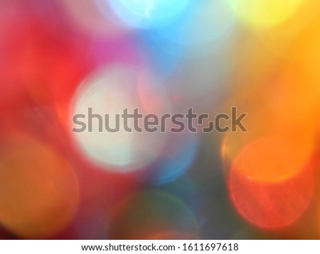 Multicolored red yellow orange blue green white pink  rainbow circle rounded bokeh dots  blurred lights abstract background texture web wallpaper banner design.Summer and spring nature photo template.