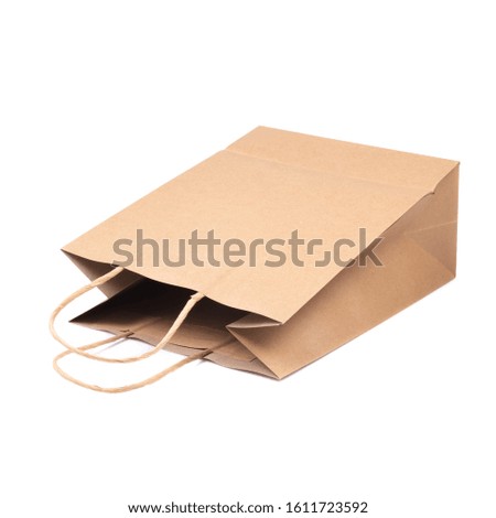 Brown paper bag or shopping paper bag isolated on white background