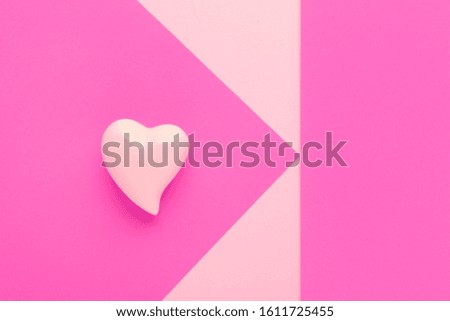 pink background with a heart and copy space