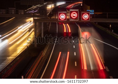 traffic control system with speed display at night, speed limit 100