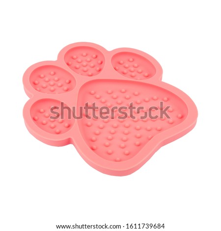 Dog rubber Distraction Device,  Lick Pad, Bath Toy, treat Paw Pad isolated on white , stock photography