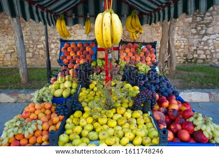 greengrocer selling fruit on the street.
