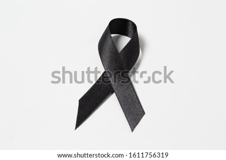 A black awareness ribbon isolated on white background