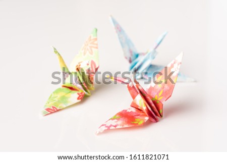 Japanese crane origami isolated against white background