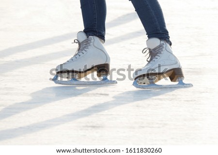 girl ice skating on an ice rink
