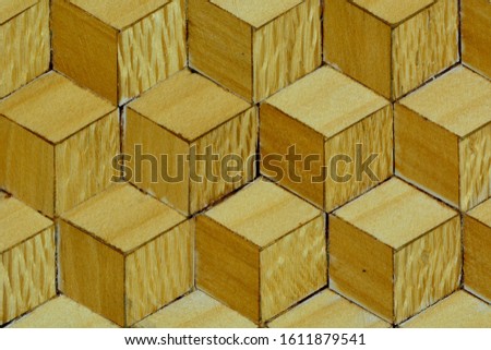 Wooden installation made of different types of wood, representing geometric pattern.
