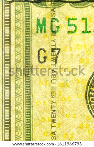 Plastic security strip inside 20 USD banknote. Security strip on American banknote created to prevent counterfeiters.