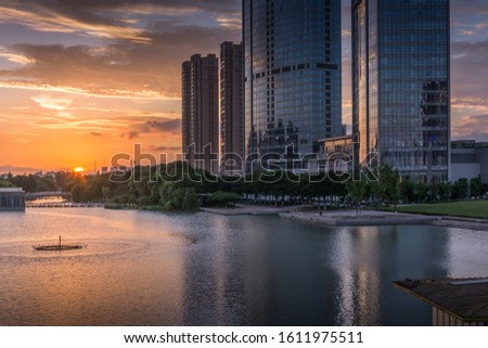 Modern commercial building at sunset by the small lake