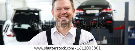 Smiling man worker repair car service portrait. Training profession automotive mechanic concept