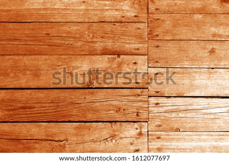 Old wooden wall in orange tone. Abstract background and texture for design.