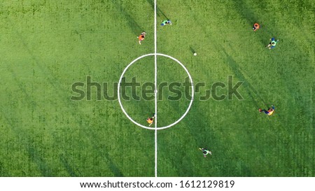 The beginning of a football match and scoring a Goal. Aerial shot of a football match the view from the top