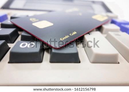 There are calculators and bank cards on the desk