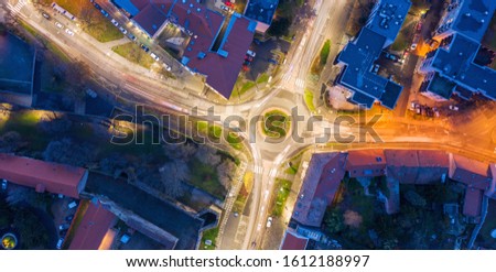 Aerial drone photo of roundabout in a  city during the night with lights