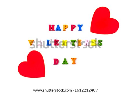 Happy Valentines day multicolored letters text with two red hearts on white background isolated close up view. Valentine's Day Holiday greeting card concept.