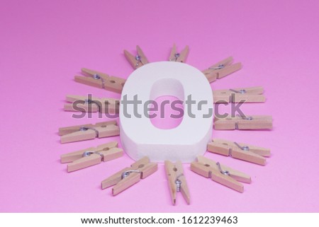 0 Zero object on pink background with brown clip around Zero - No Cost Concept - Pink concept 