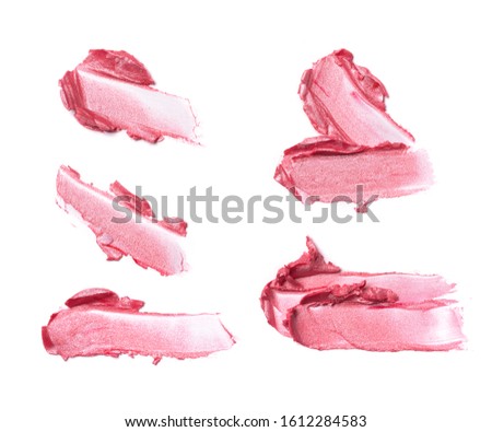 Brush strokes set of bright pink lipstick as sample of cosmetic product isolated on white background