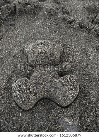 Holidays by the sea Gray sand Royalty-Free Stock Photo #1612306879