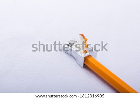 pencil and metal sharpener isolated on white background