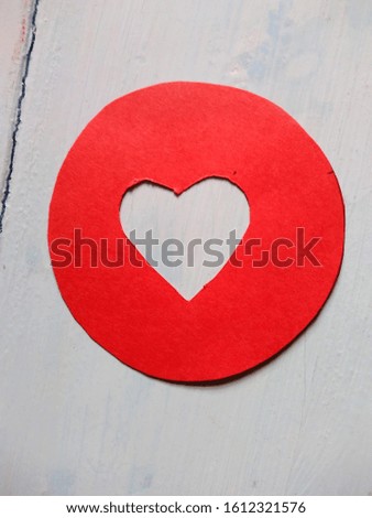 white heart cut in a red circle