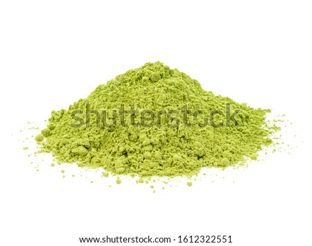 Green matcha powder on white background. Matcha made from finely ground green tea powder. Eat healthy because of high antioxidants.