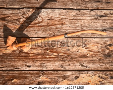Ancient  clay pipe on a wooden background