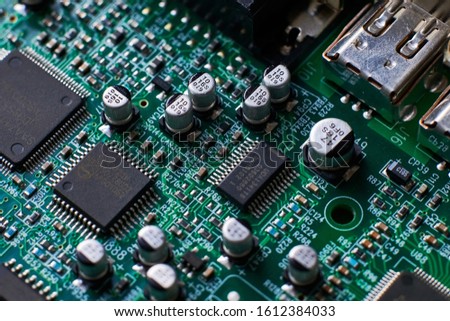 printed circuit Board with chips and radio components electronics Royalty-Free Stock Photo #1612384033
