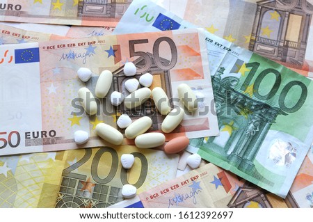 medicine pills over euro banknotes. concept photo