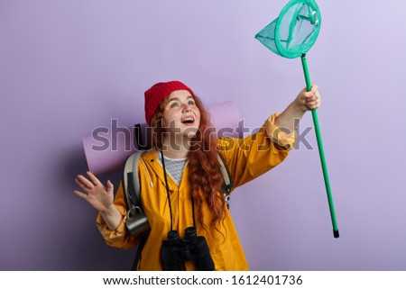 funny playful girl having fun with a net, close up photo. entertainment, fun, happiness concept