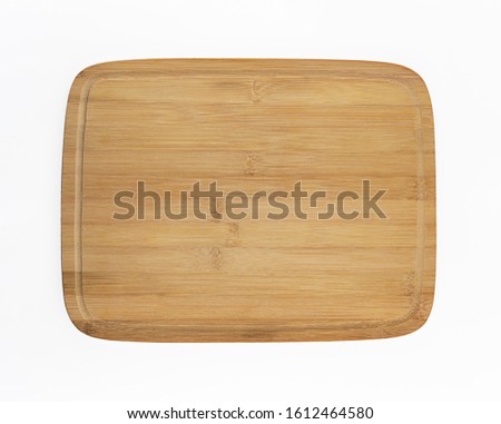 Empty wooden platter. Flat lay serving board isolated on white. Bamboo chopping board. Blank wood for food background. Royalty-Free Stock Photo #1612464580