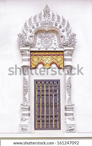 Stucco on the window in the temple of Chiang mai ,Thailand. 